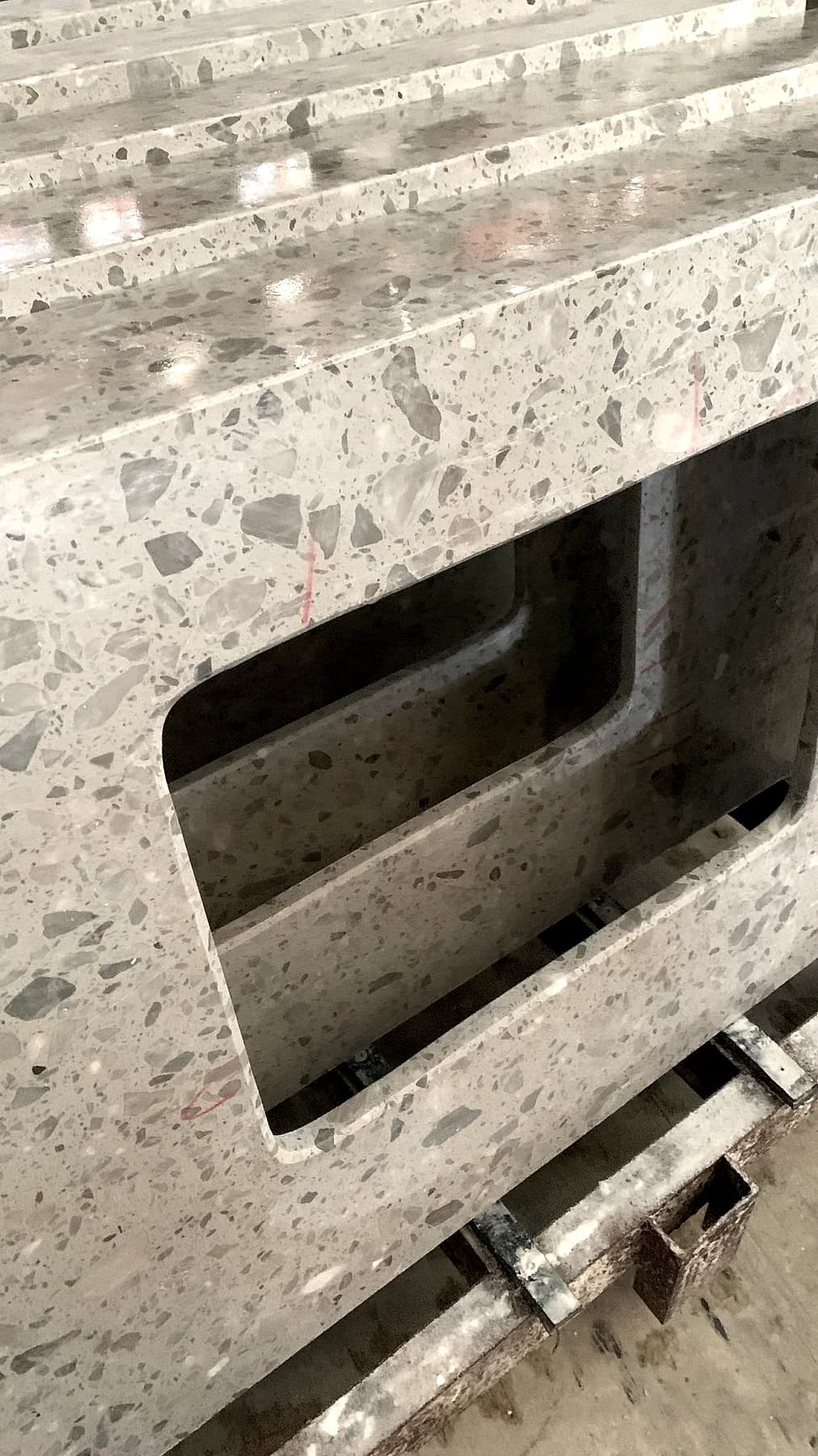 Speckled stone basin component with a rectangular opening shown upright.