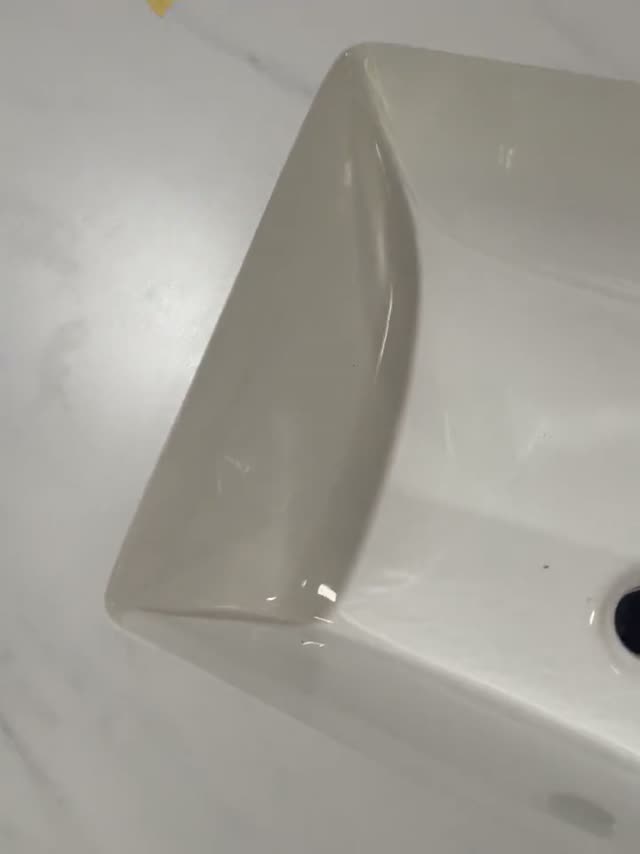 A close look at the corner profile of a custom stone basin.