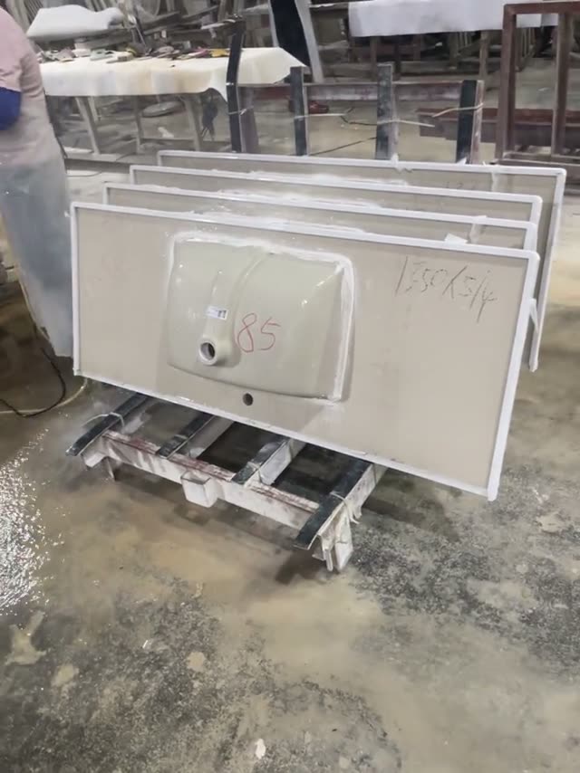 A double-basin stone vanity unit shown in the workshop.