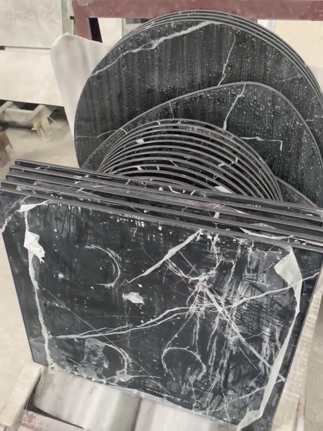 Dark stone panels with curved outlines are shown together.